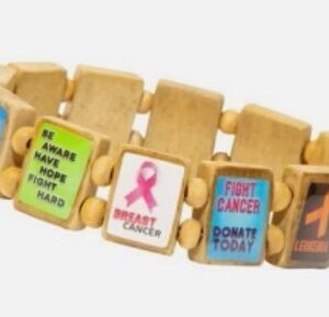 colorful crafty bracelet with a variety of cancer support messages